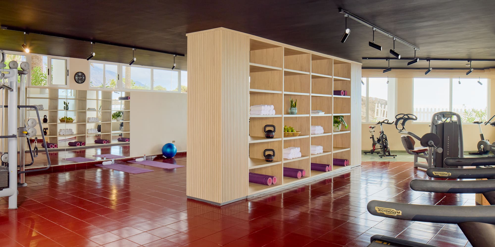 a gym with exercise equipment and exercise equipment
