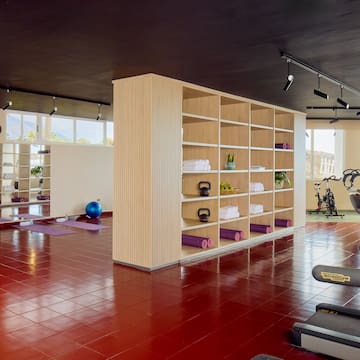 a gym with exercise equipment and exercise equipment