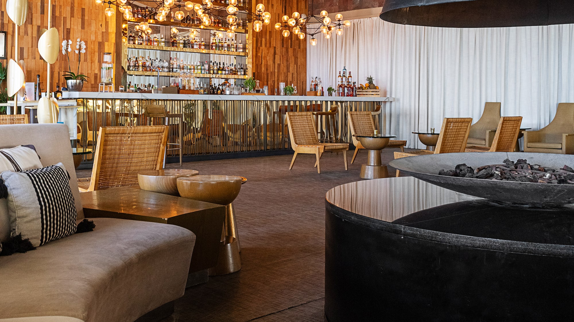 a room with a fireplace and chairs