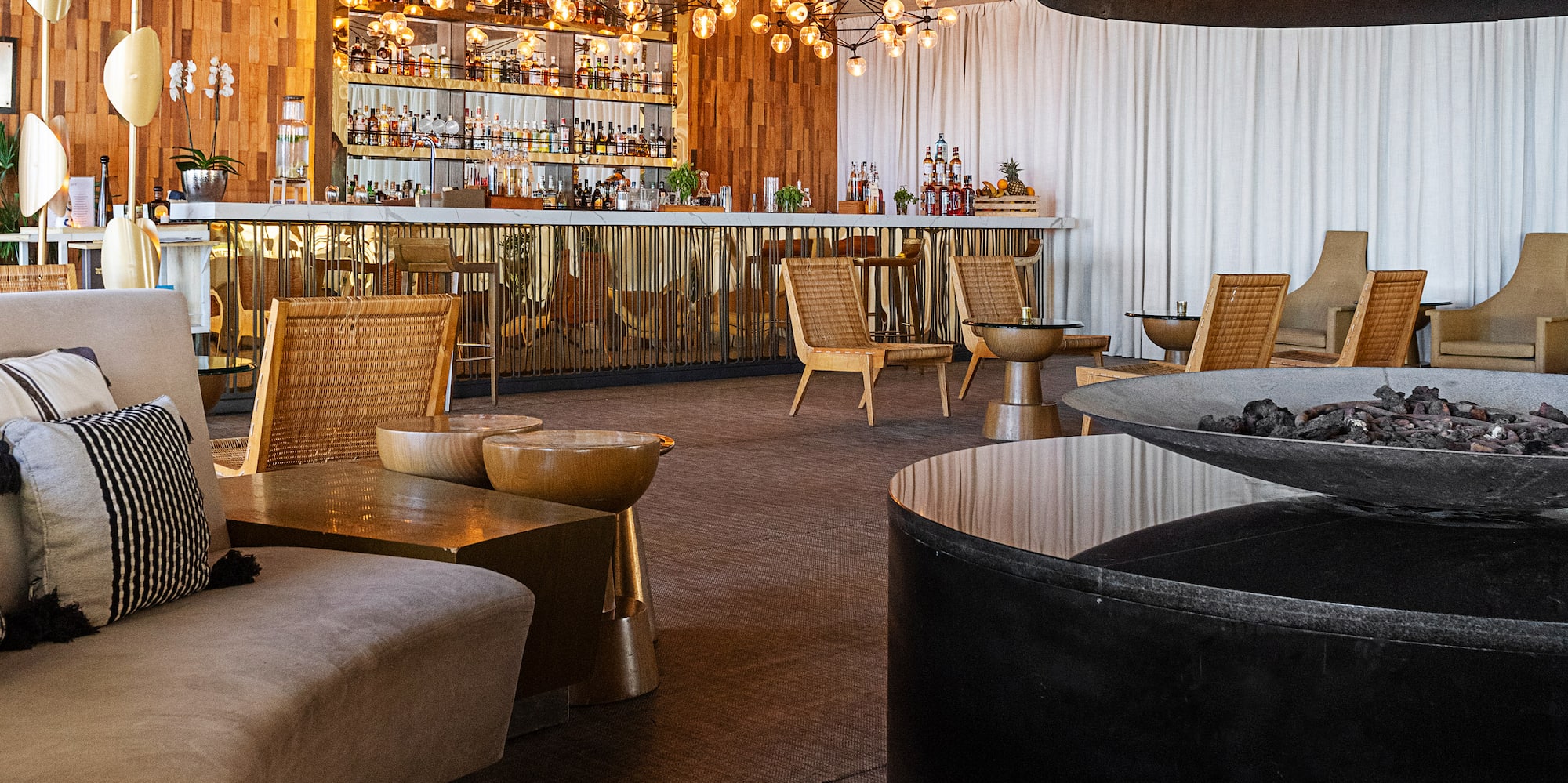 a room with a fireplace and chairs