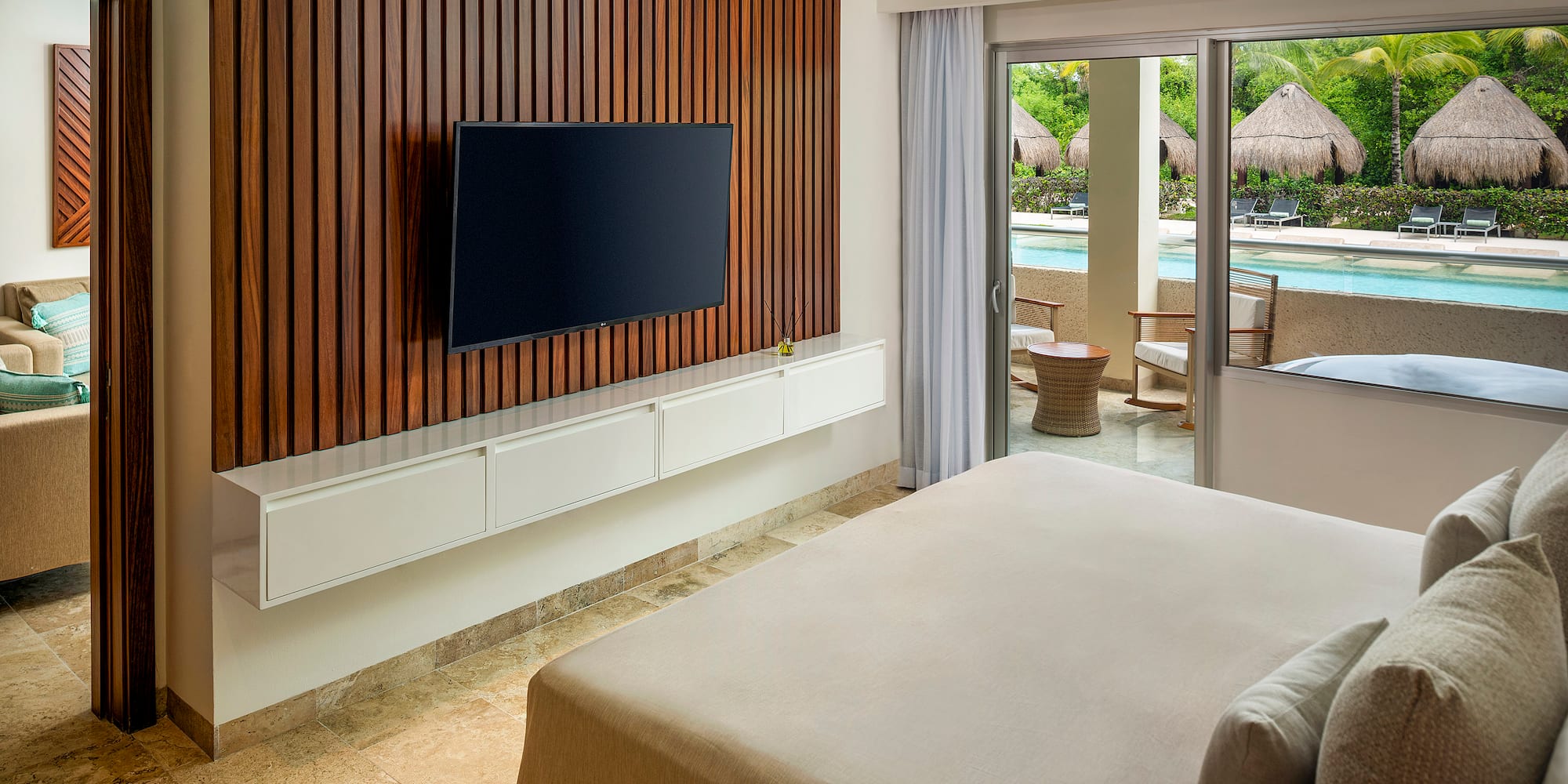 a room with a television and a pool