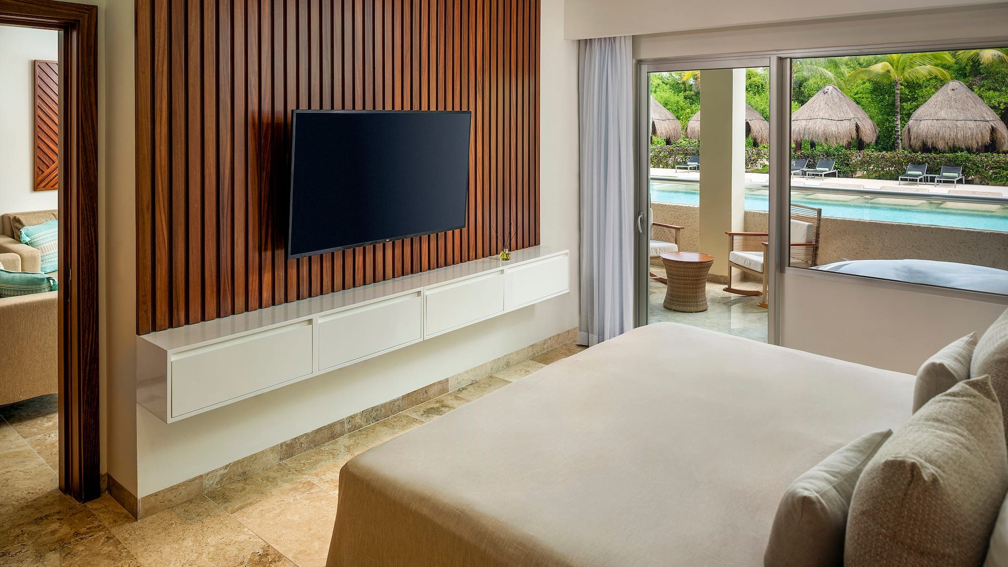 a room with a television and a pool