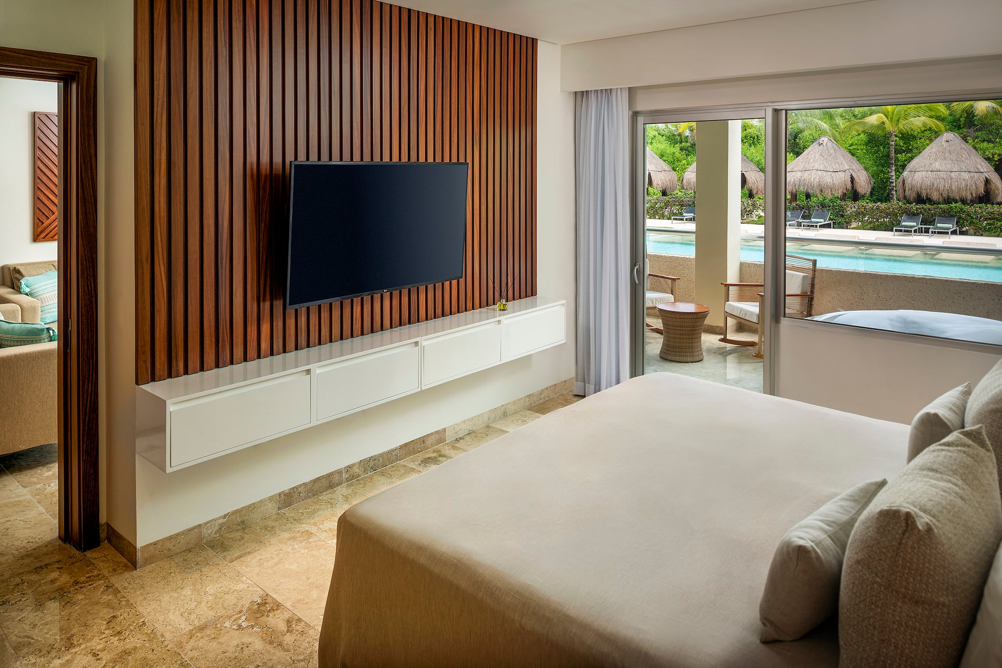 a room with a television and a pool