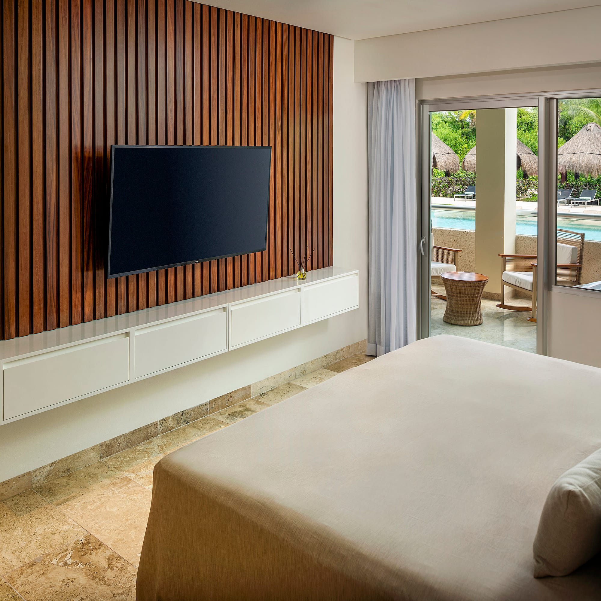 a room with a television and a pool