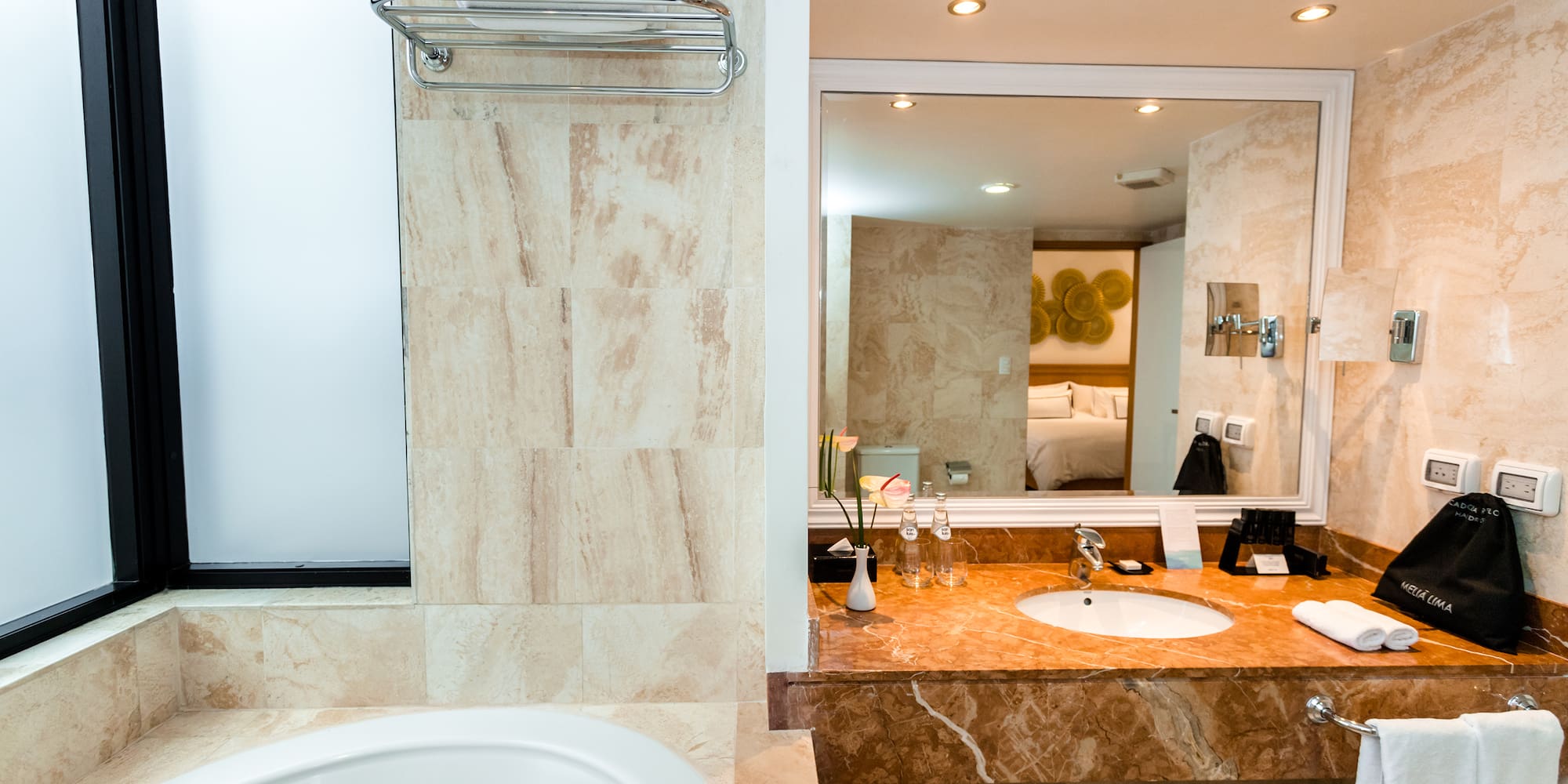 a bathroom with a sink and mirror