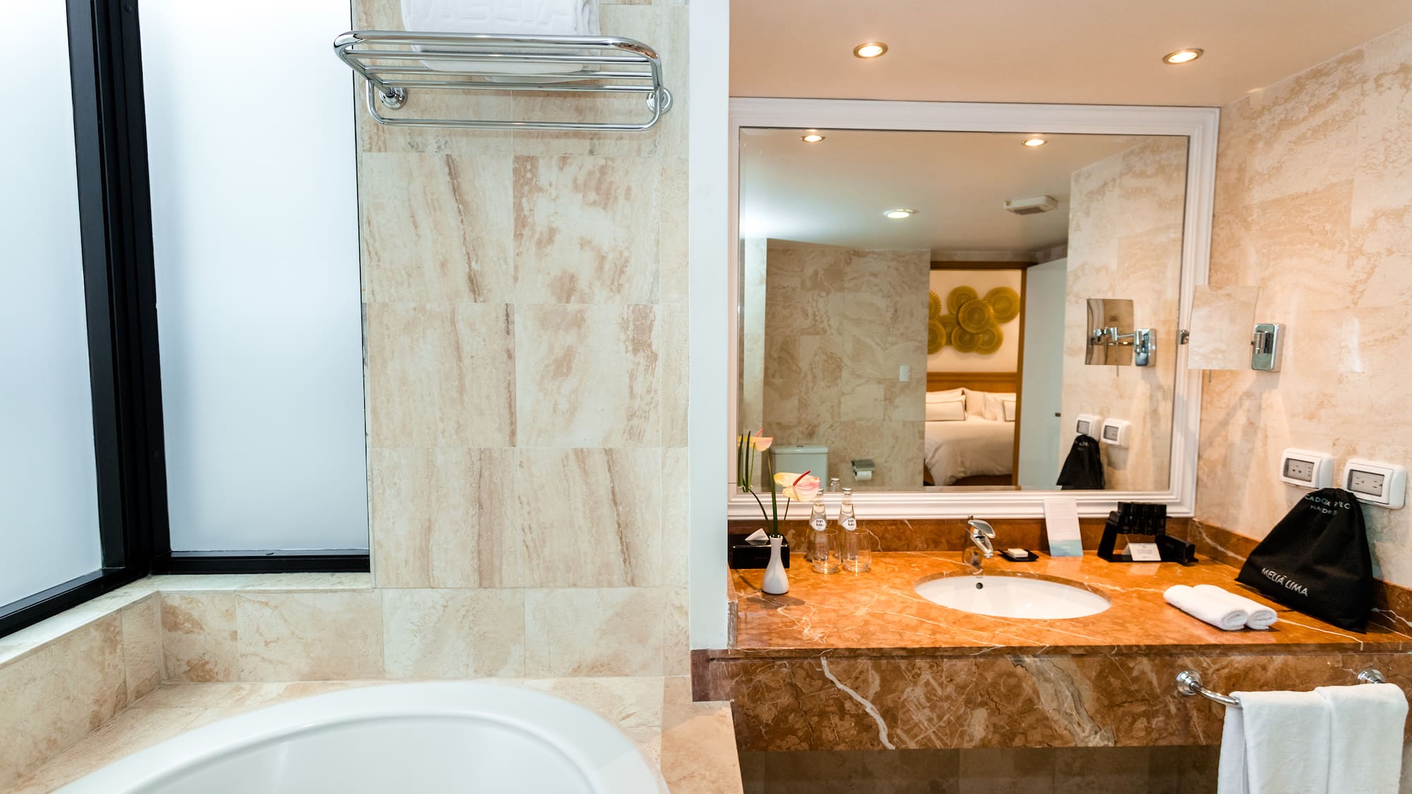 a bathroom with a sink and mirror