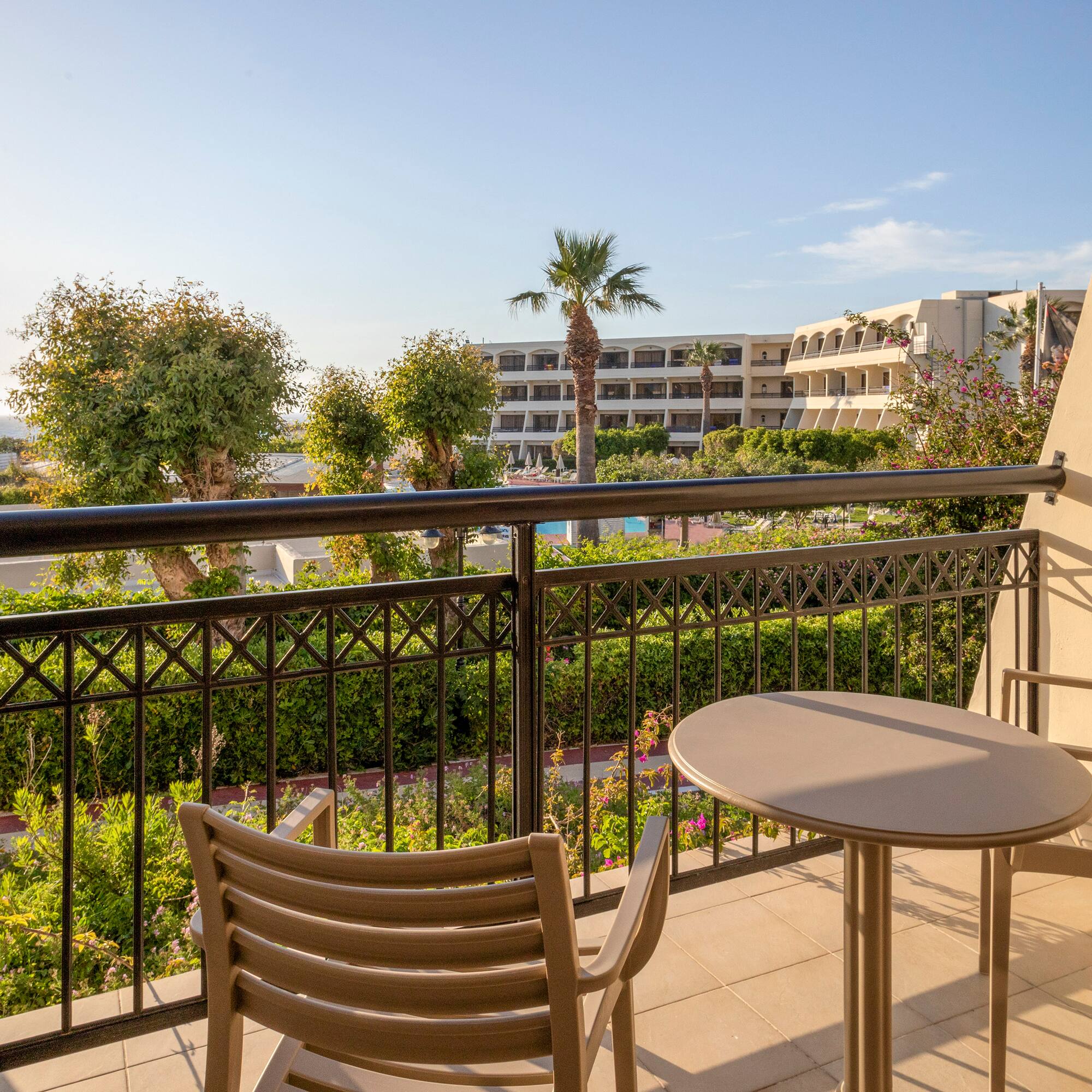 a table and chair on a balcony