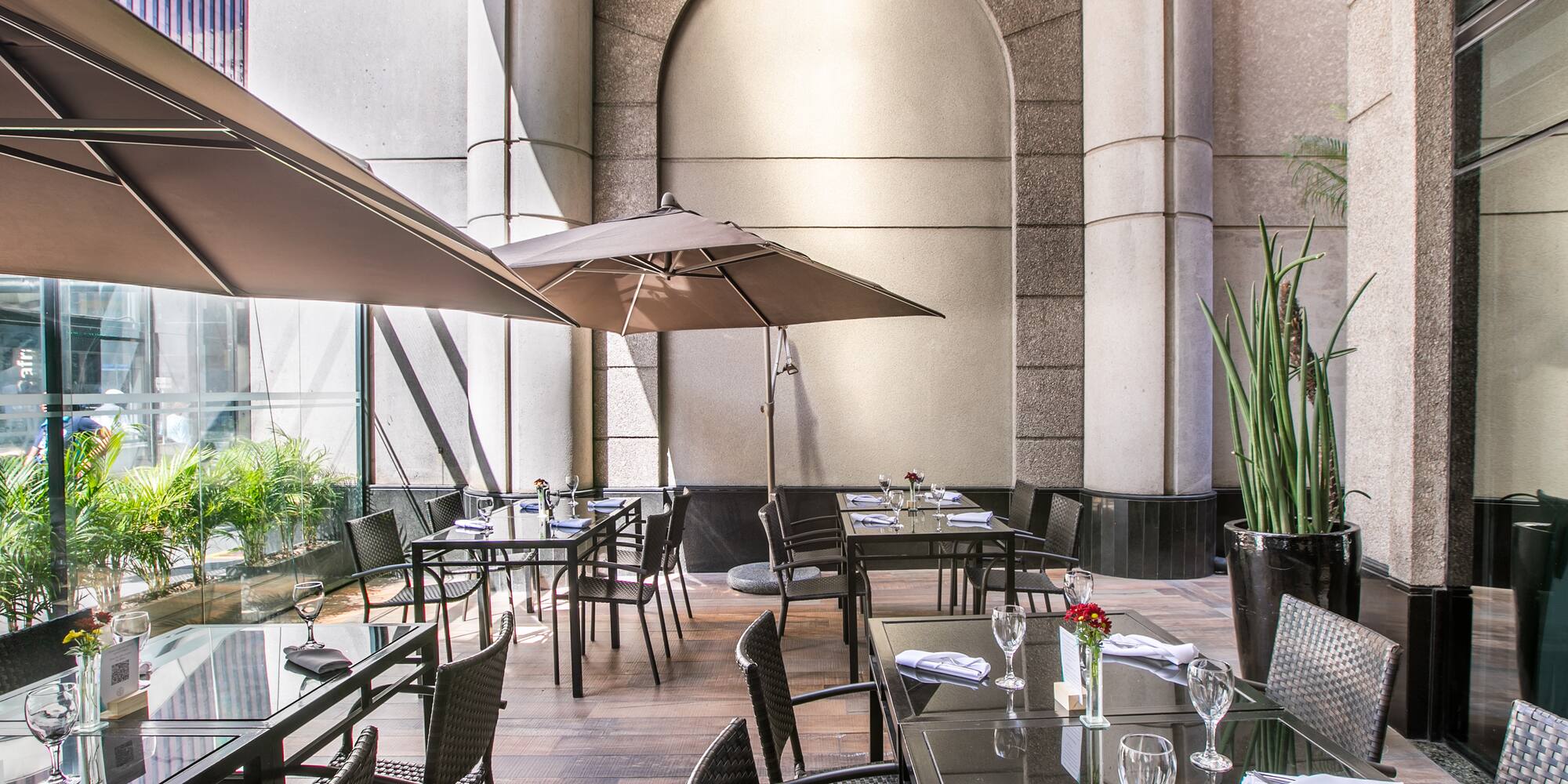 a patio umbrellas in front of a building