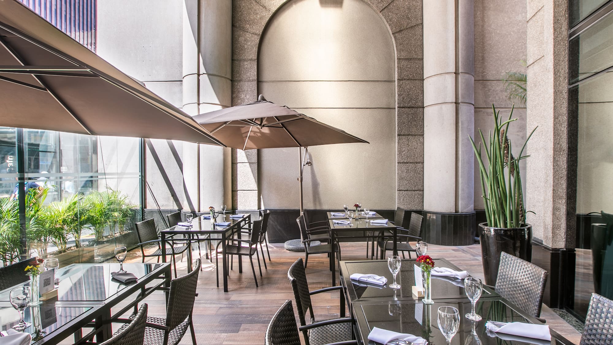 a patio umbrellas in front of a building