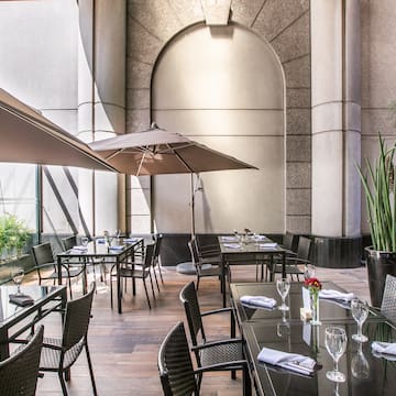 a patio umbrellas in front of a building