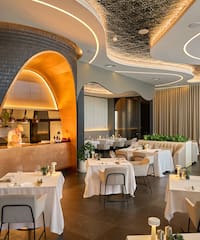 a restaurant with tables and chairs