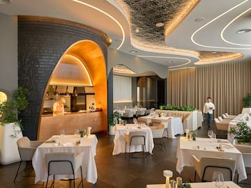 a restaurant with tables and chairs