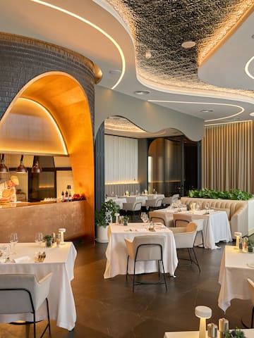 a restaurant with tables and chairs