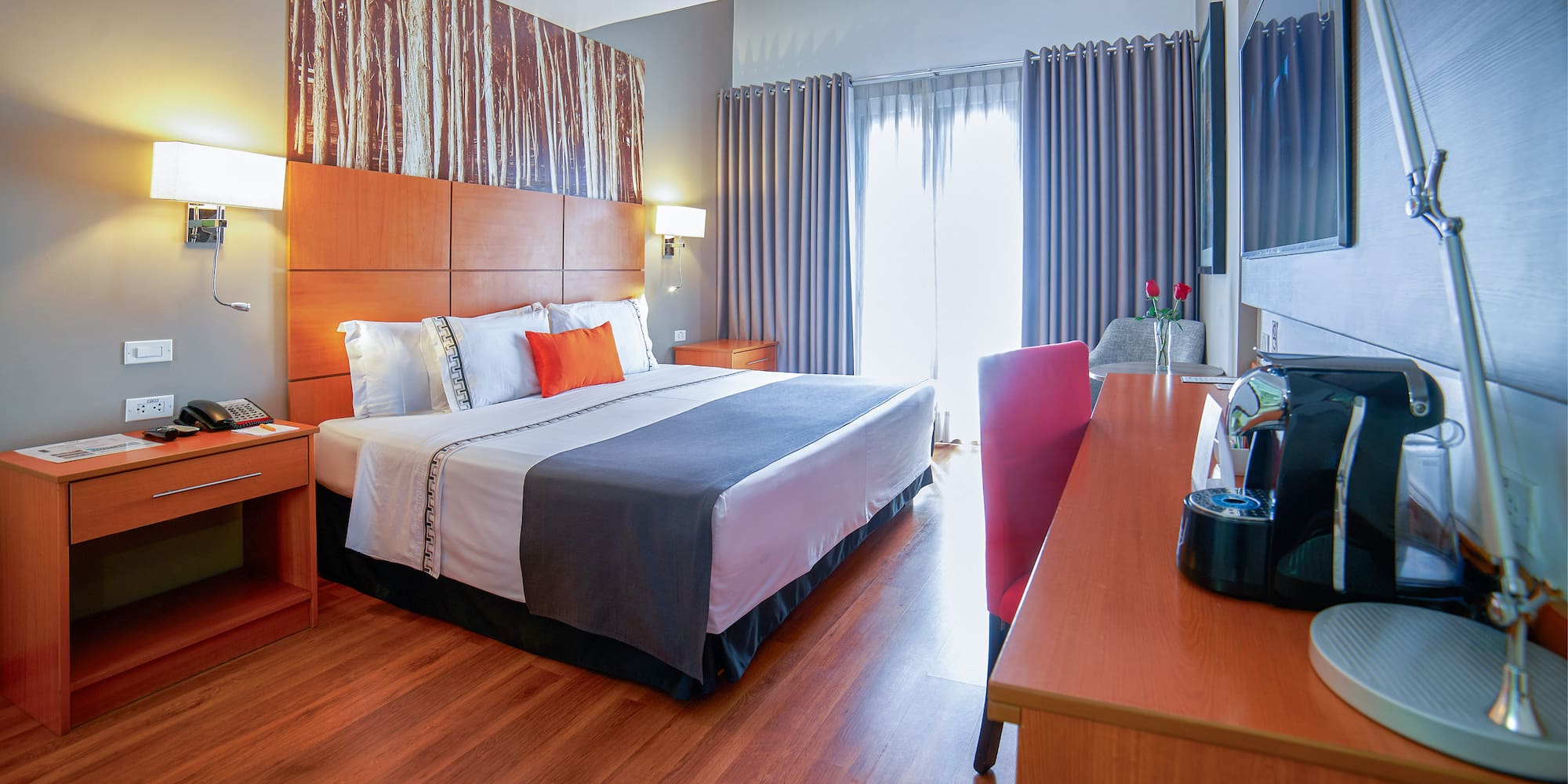 a room with a bed and a television