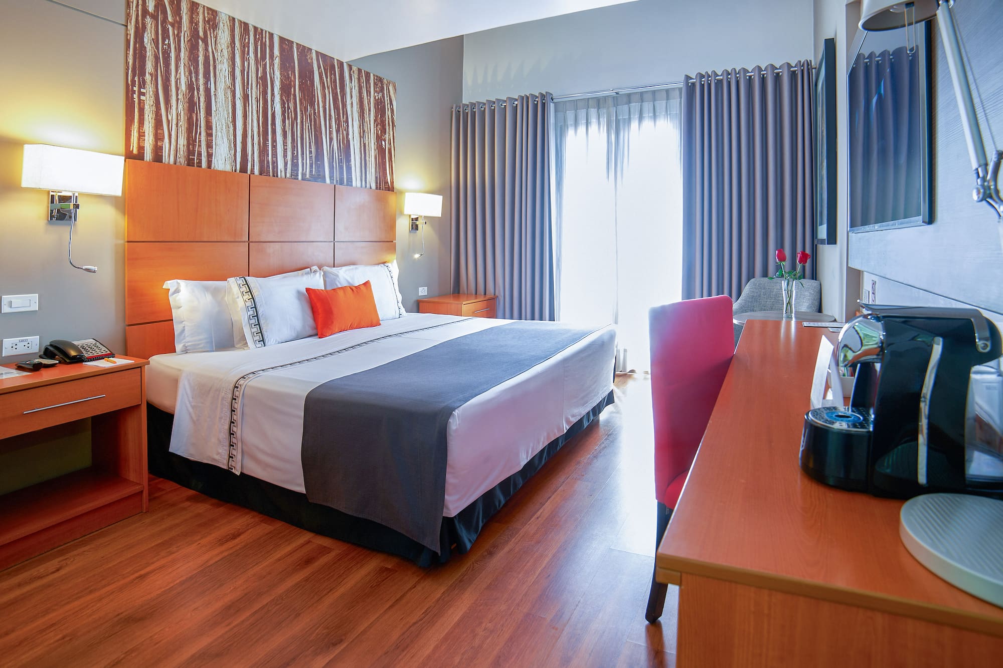 a room with a bed and a television