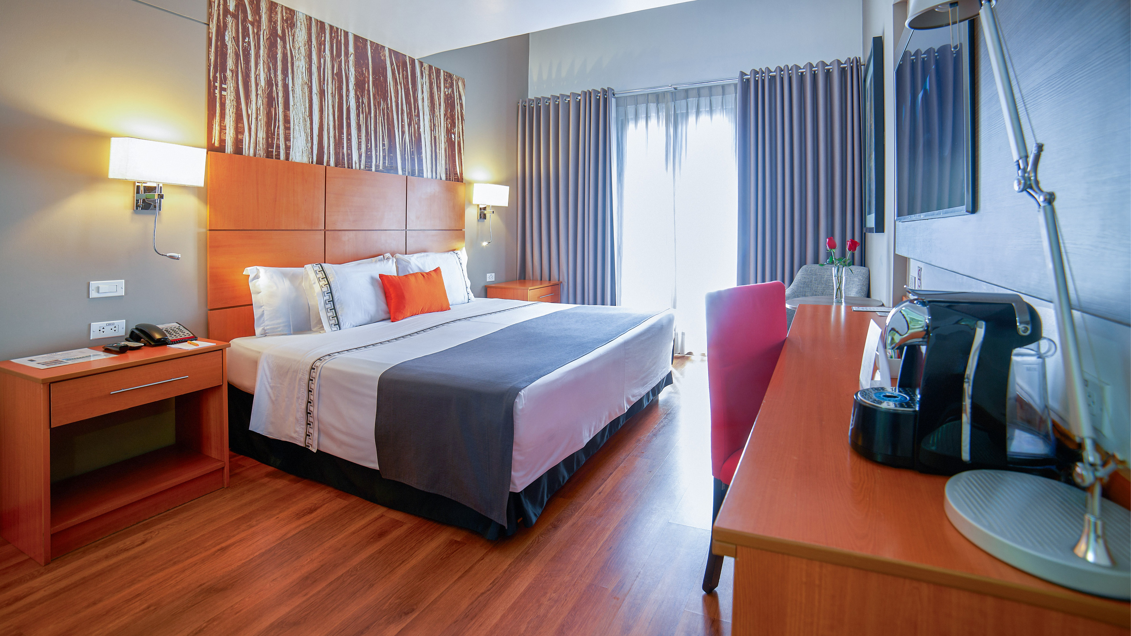 a room with a bed and a television