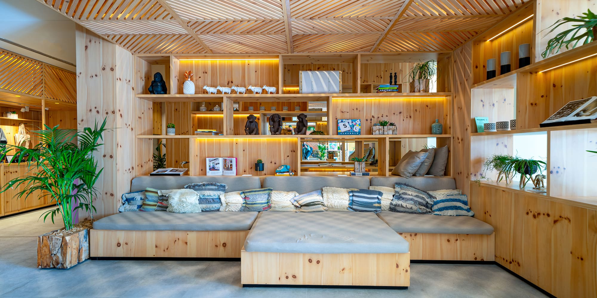 a room with a couch and shelves