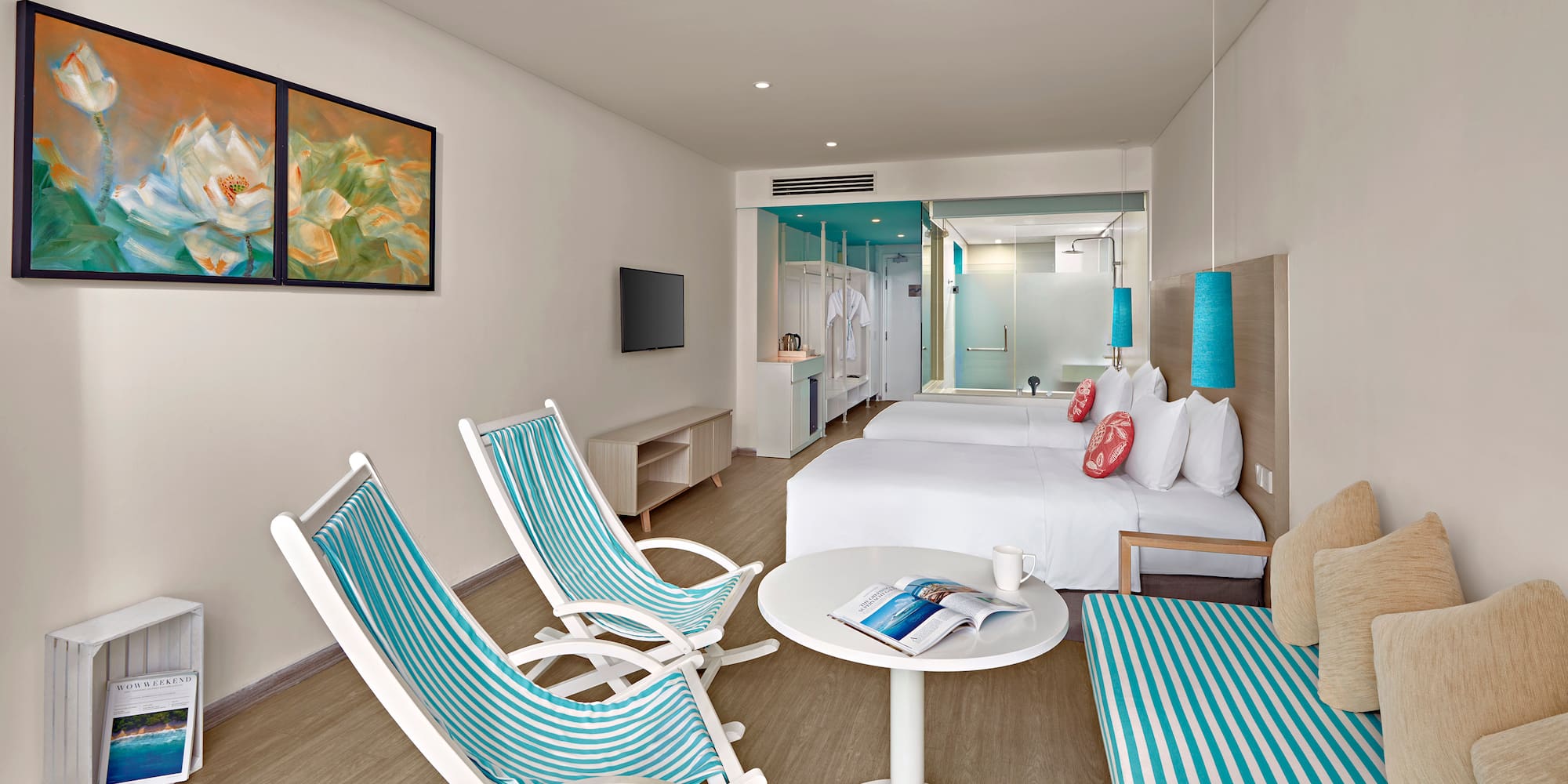 a room with a bed and chairs