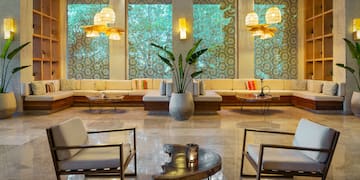 a room with a large window and chairs