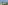Balcony with ocean view, sandy beach, desert plants, chairs, and table.