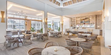 a room with tables and chairs