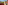 Sunny balcony with outdoor seating, mountain and resort views, tropical plants.
