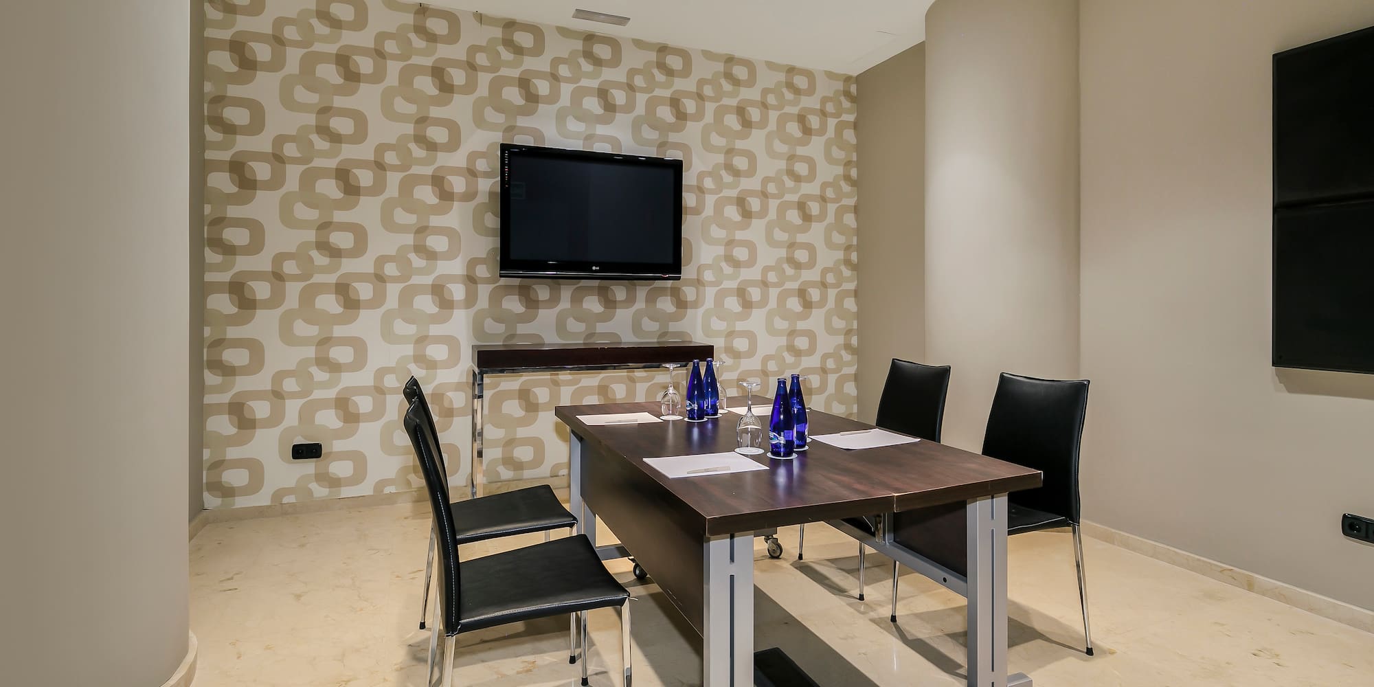 a room with a table and chairs