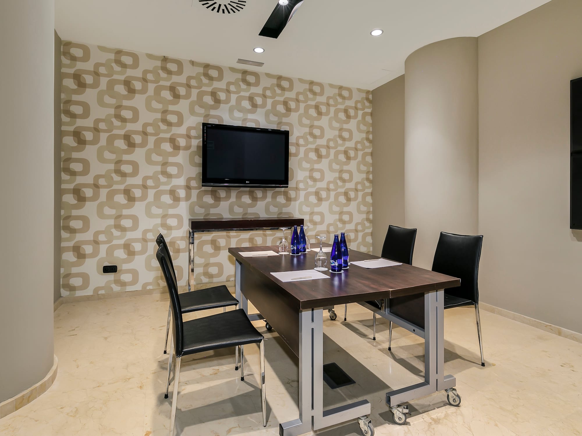 a room with a table and chairs