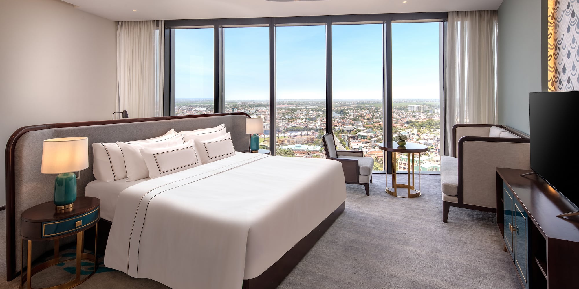 a bedroom with a large window