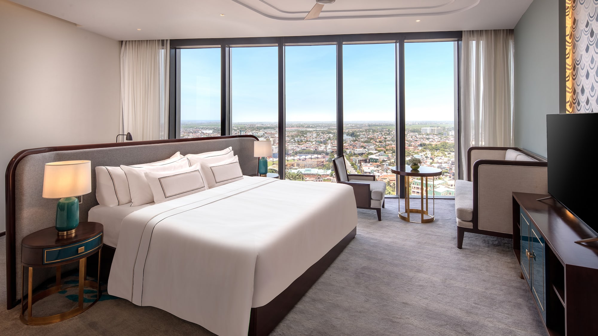 a bedroom with a large window