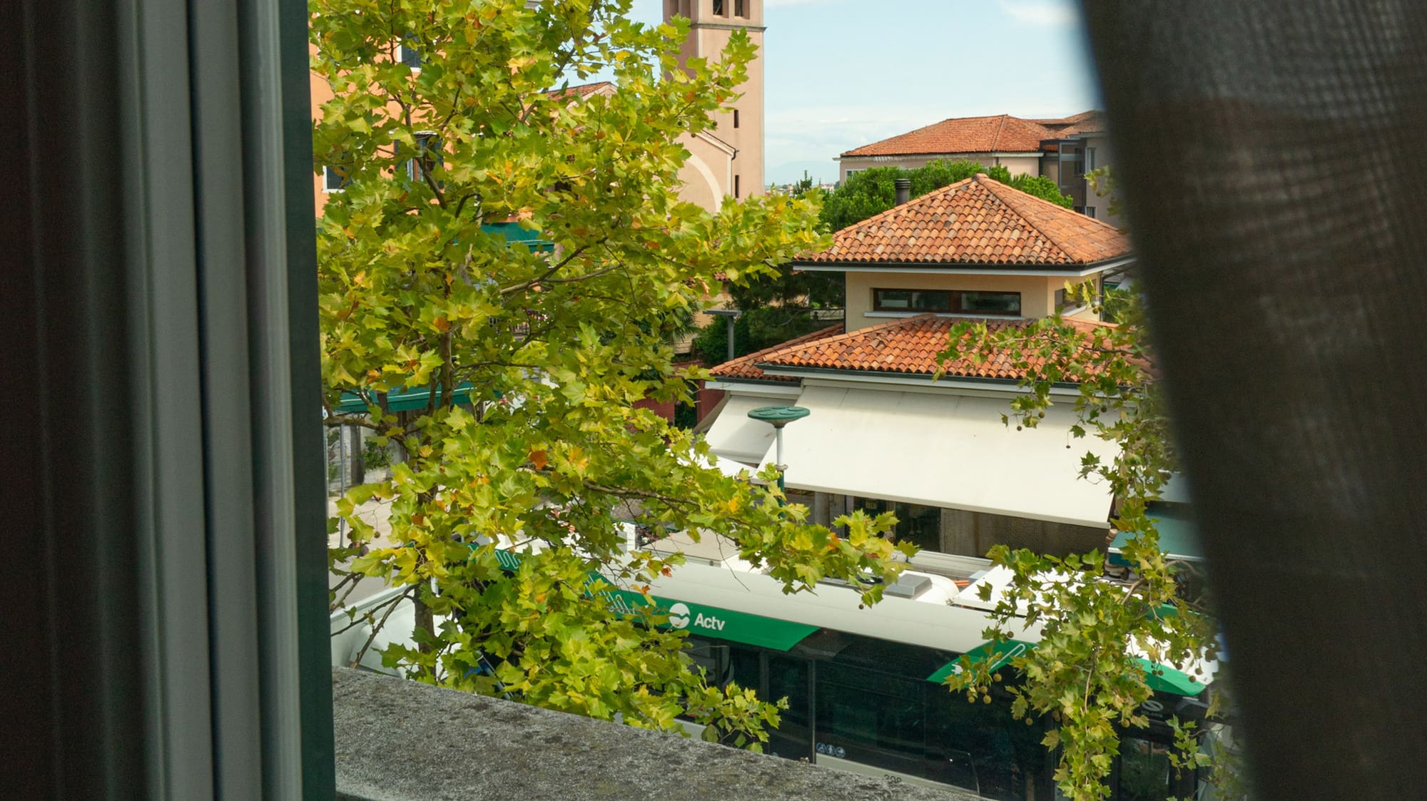 a view of a building from a balcony