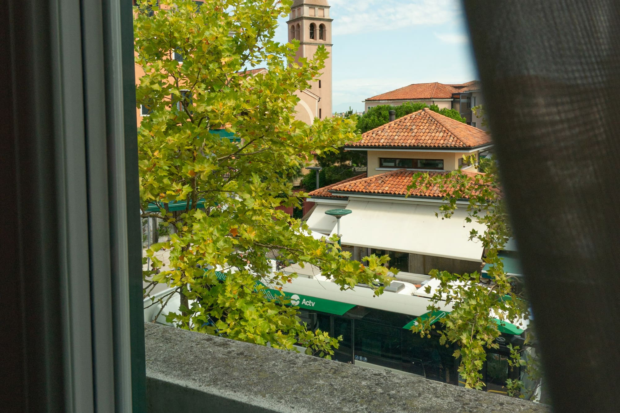 a view of a building from a balcony
