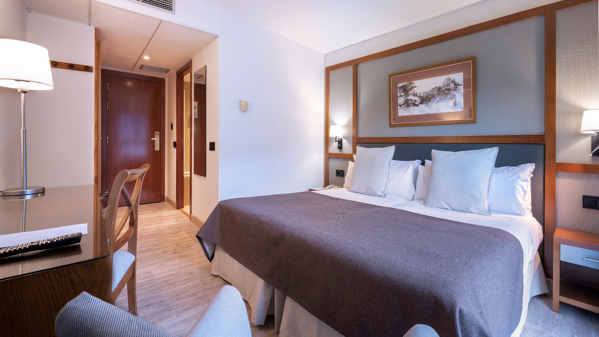 a room with a bed and a table