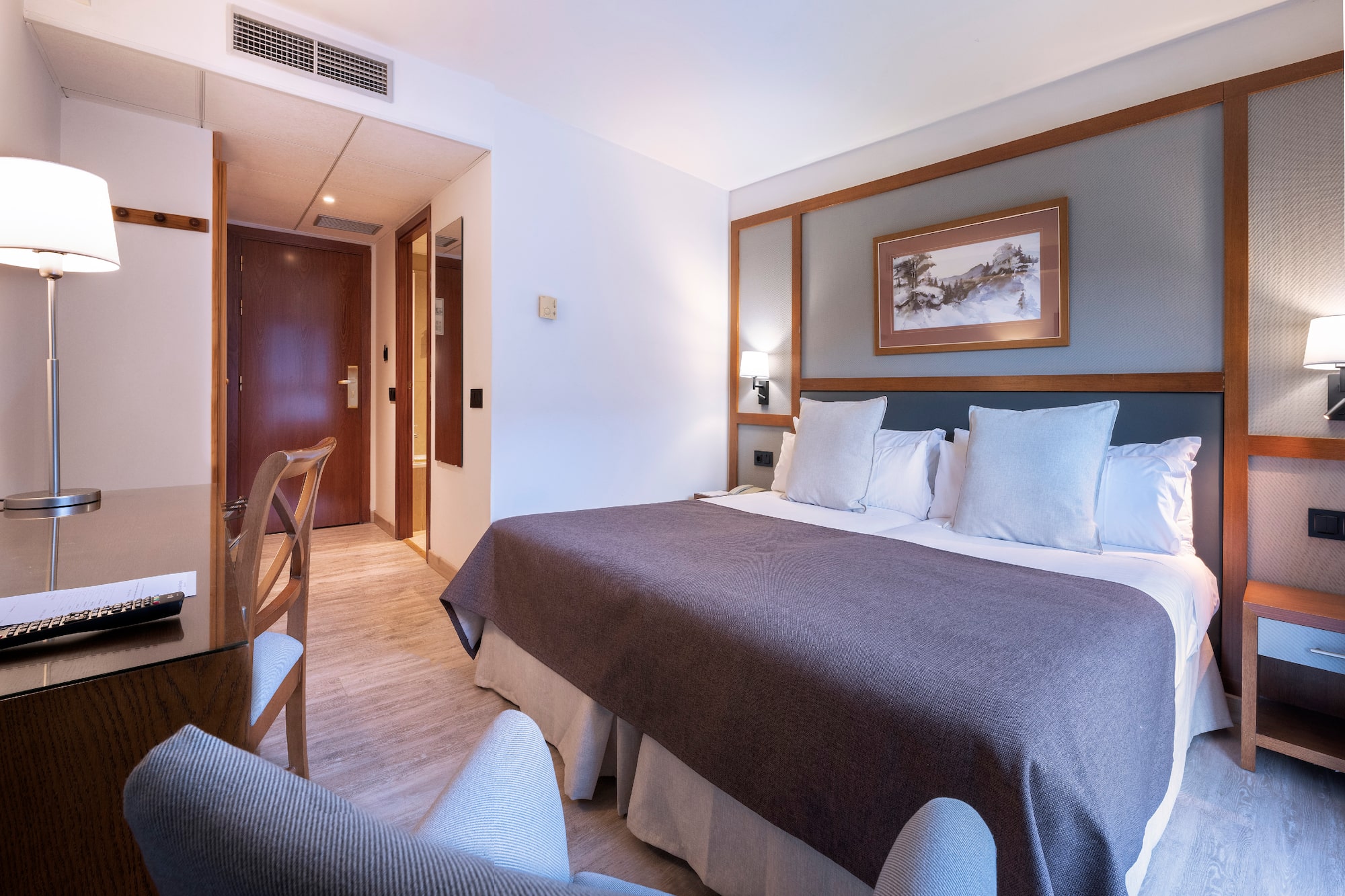 a room with a bed and a table