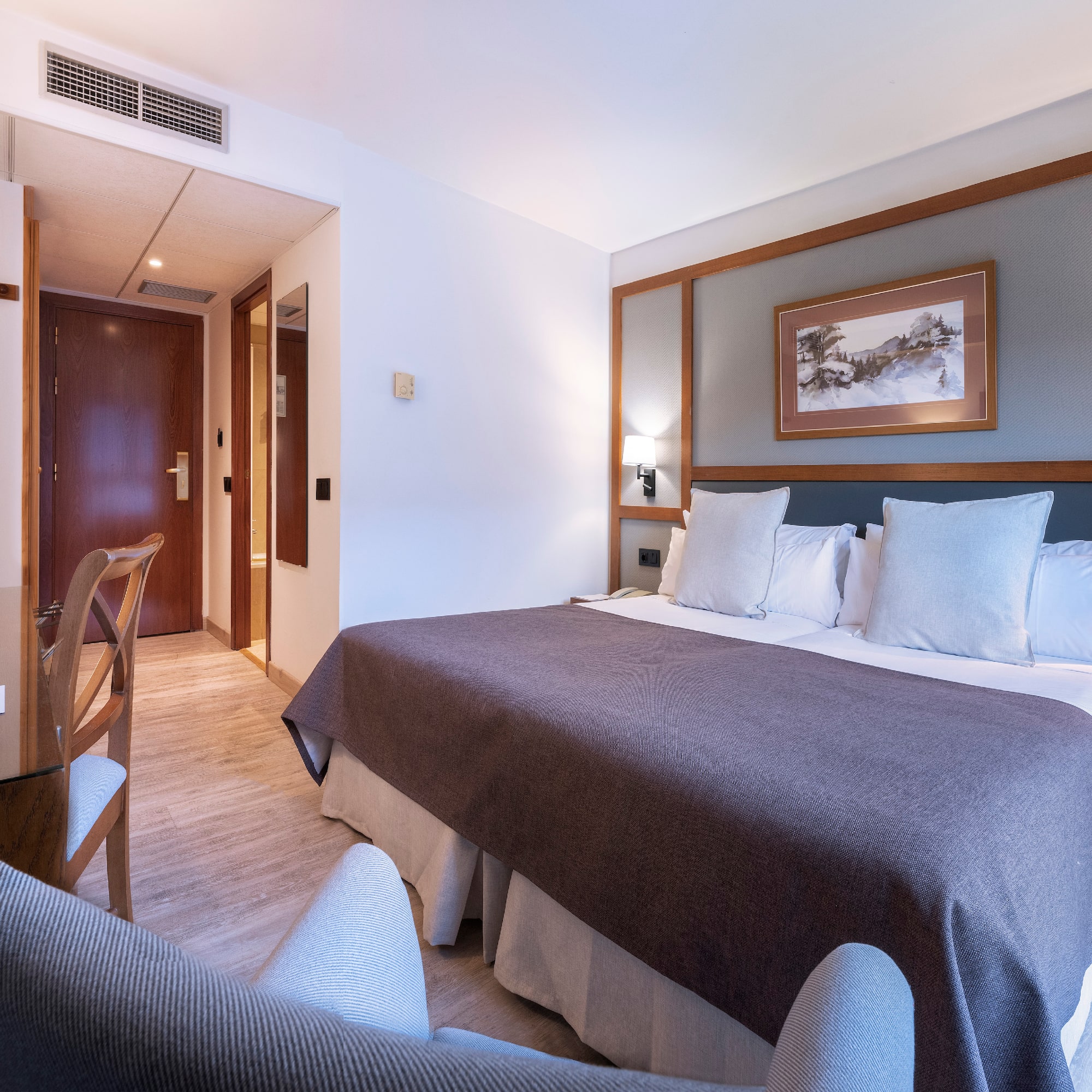 a room with a bed and a table