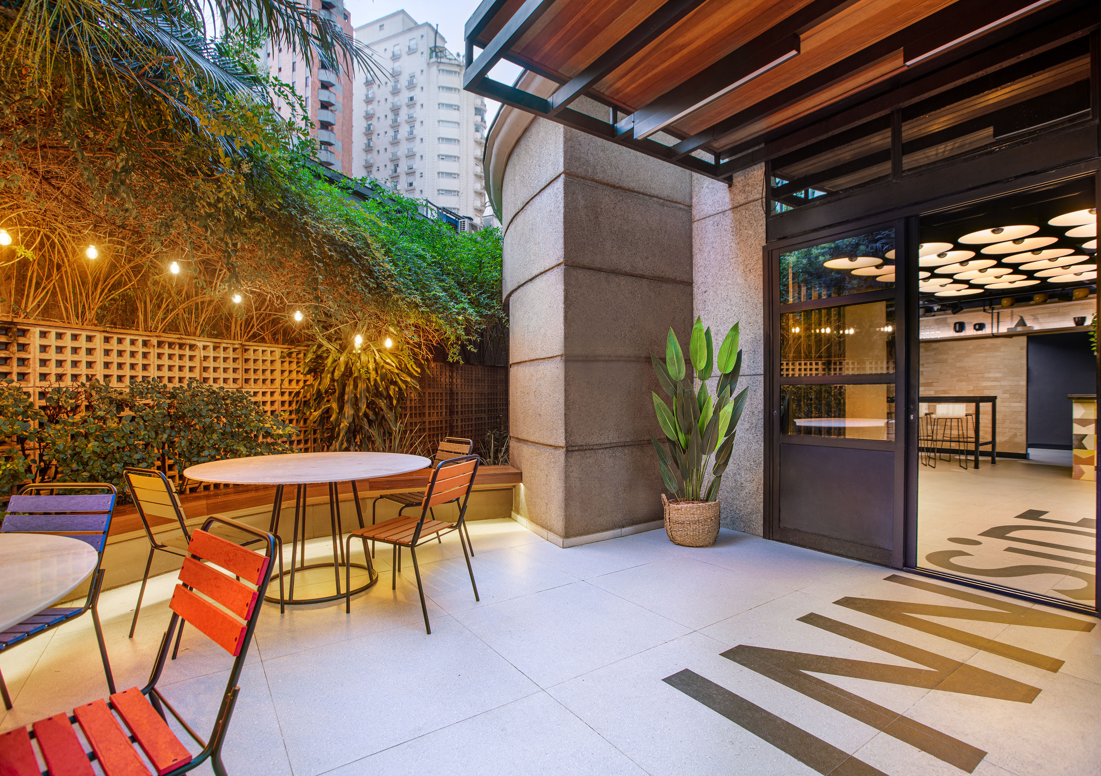 a patio with a table and chairs