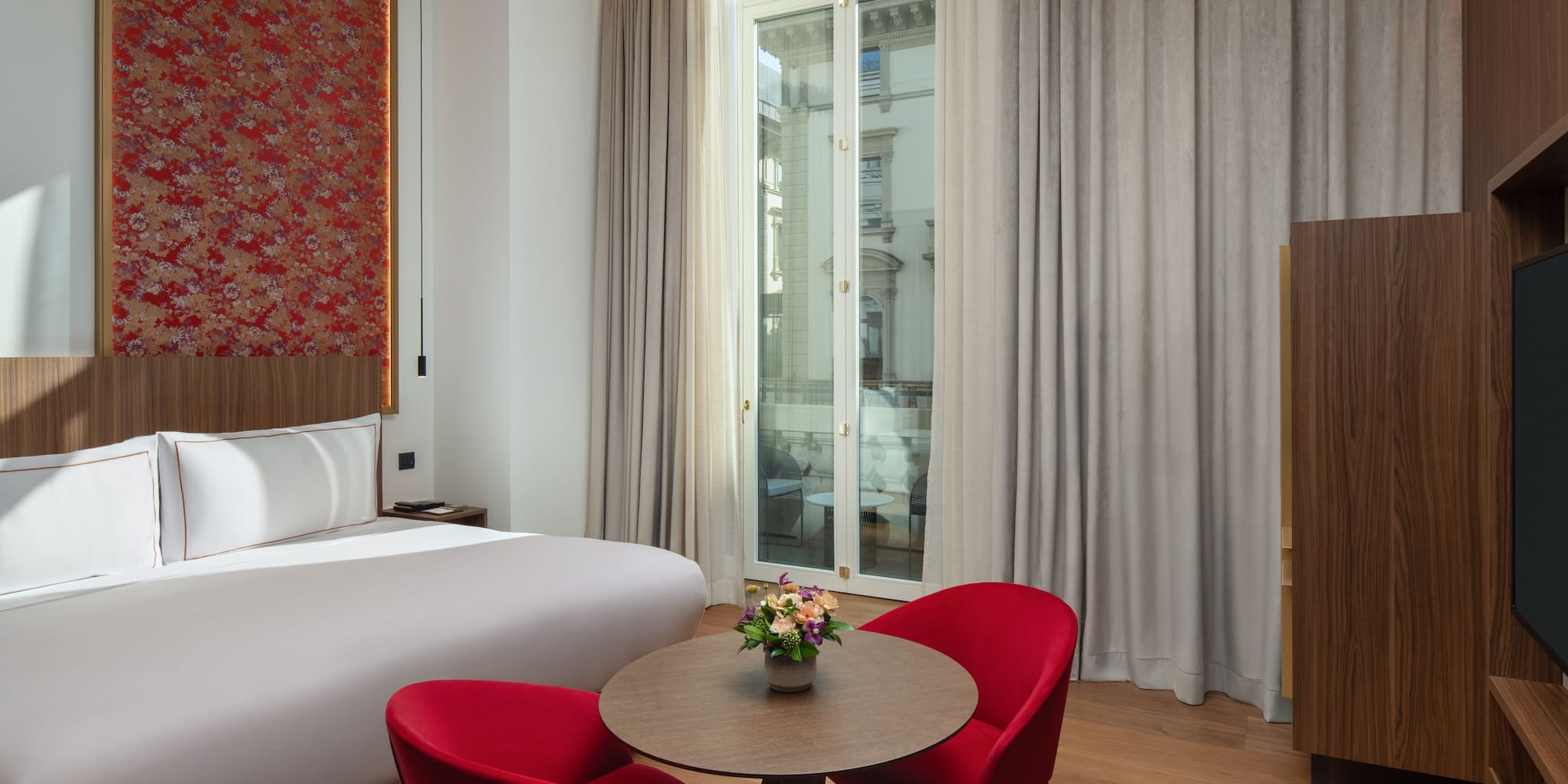 a room with a bed and a table with chairs