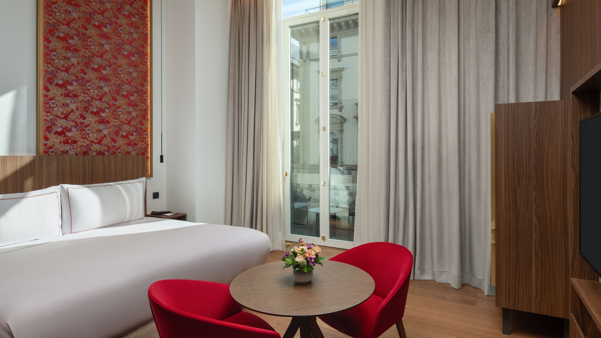 a room with a bed and a table with chairs