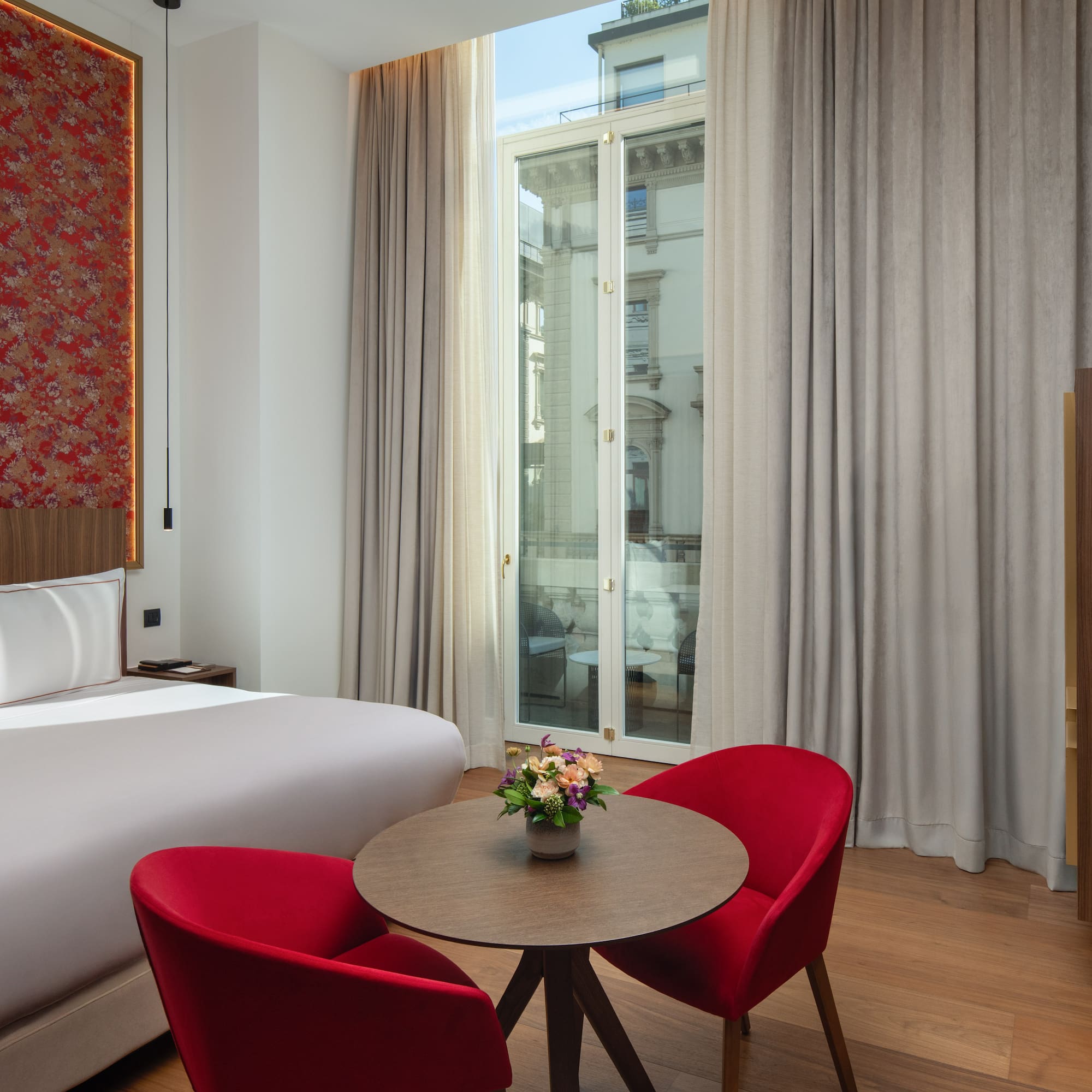 a room with a bed and a table with chairs