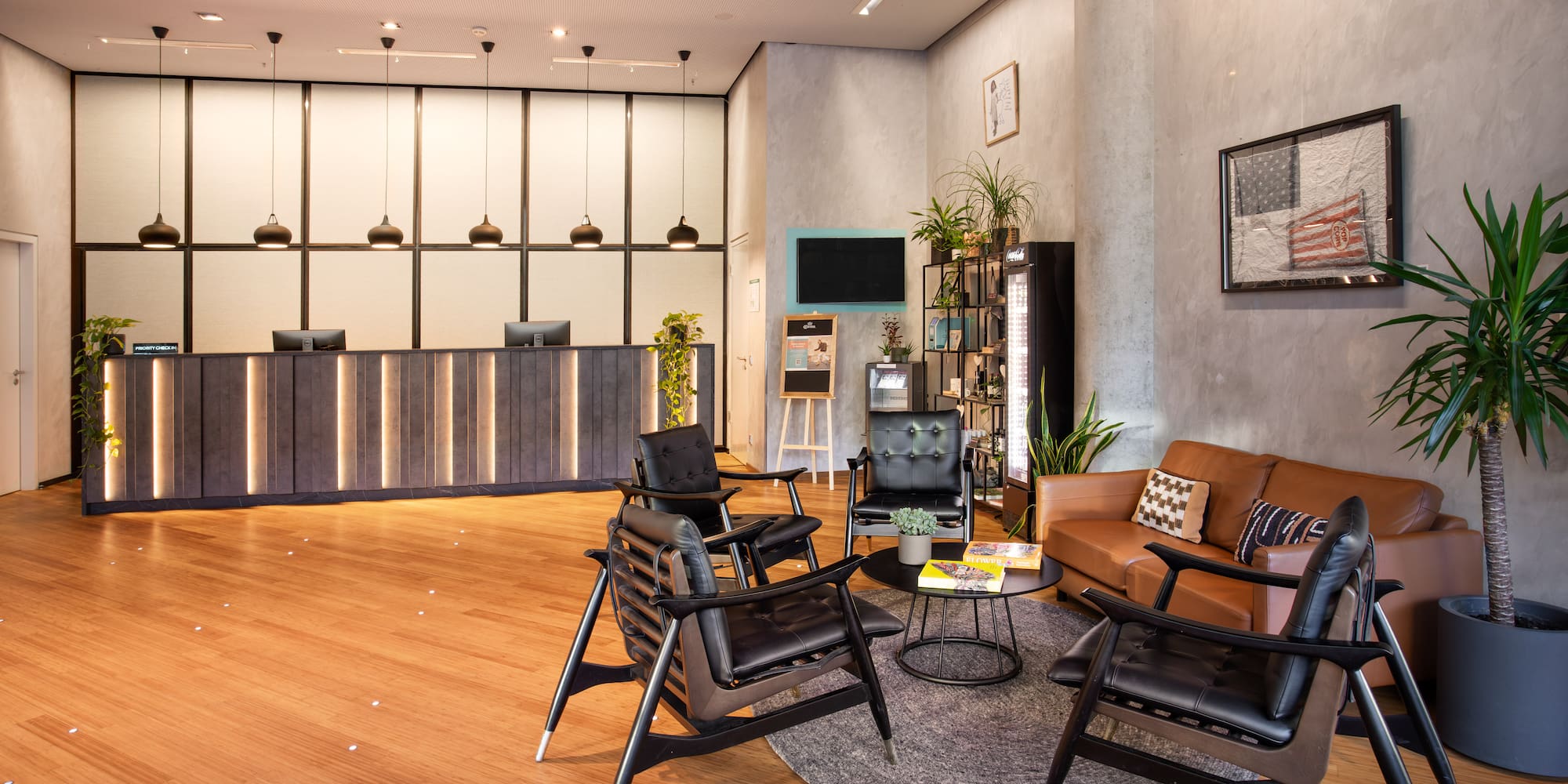 a room with a reception desk and chairs