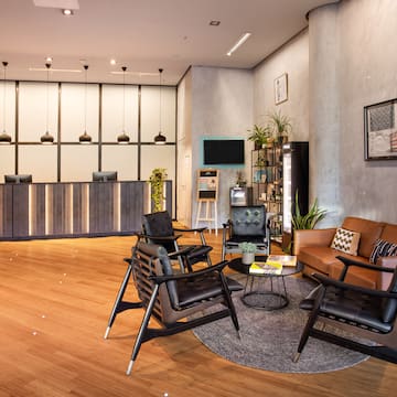 a room with a reception desk and chairs