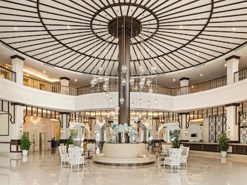 a large room with a large chandelier and a large ceiling