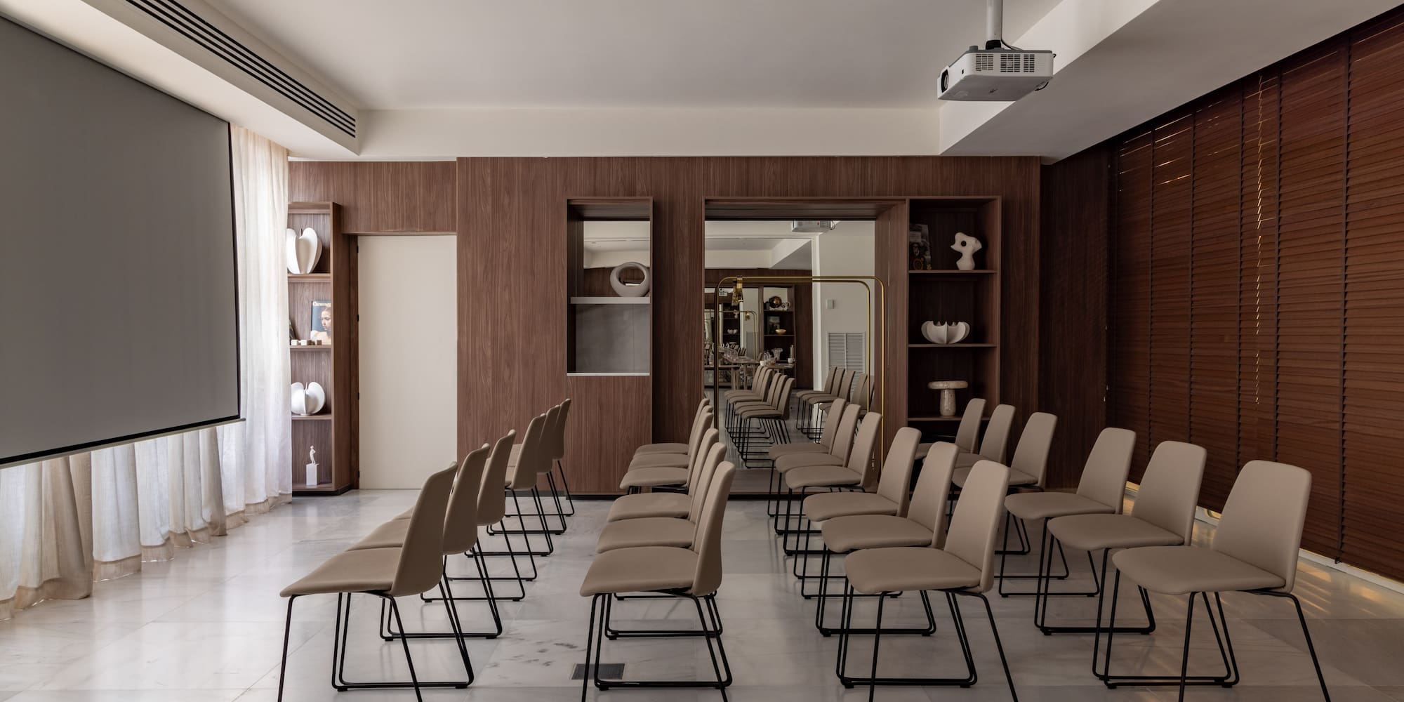 a room with chairs and a large window