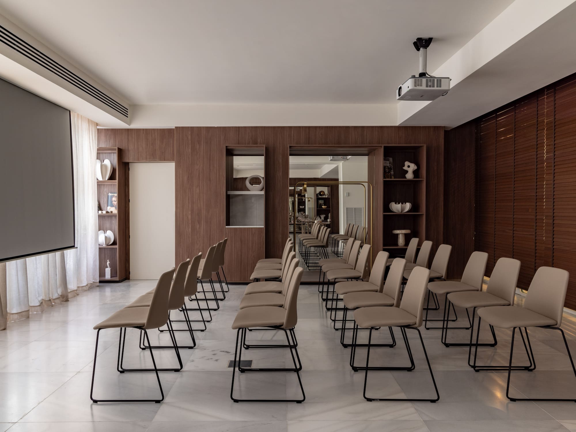 a room with chairs and a large window