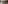 Corporate meeting room with projector screen, beige chairs, and dark wood finishes.