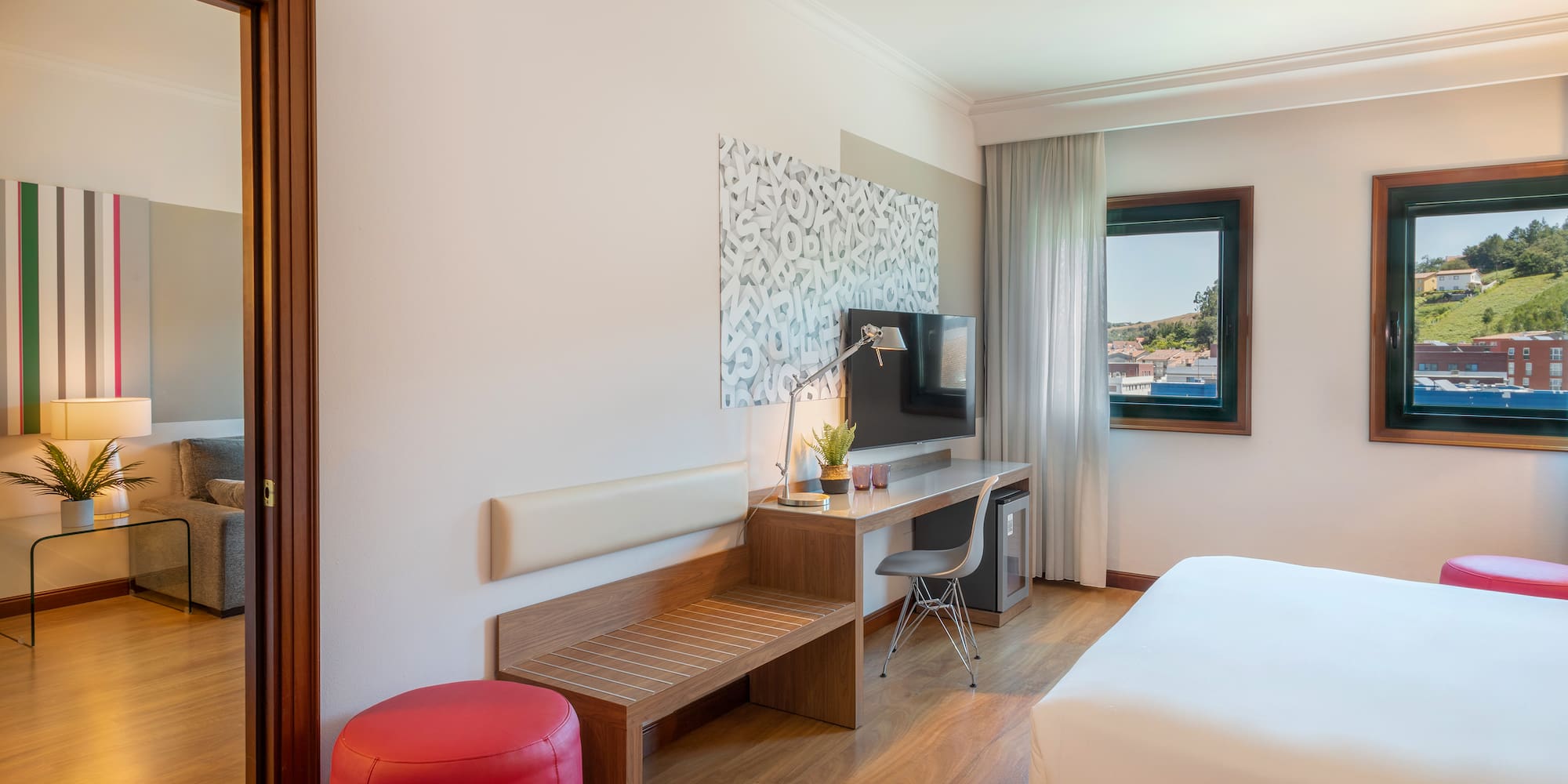 a room with a bed and a desk