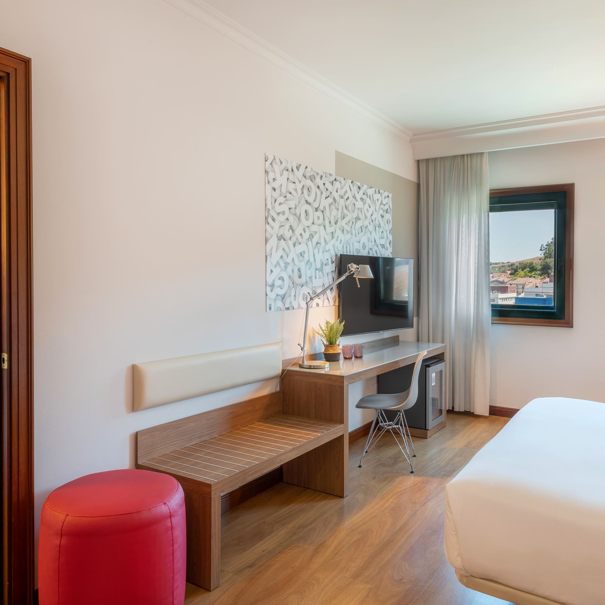 a room with a bed and a desk