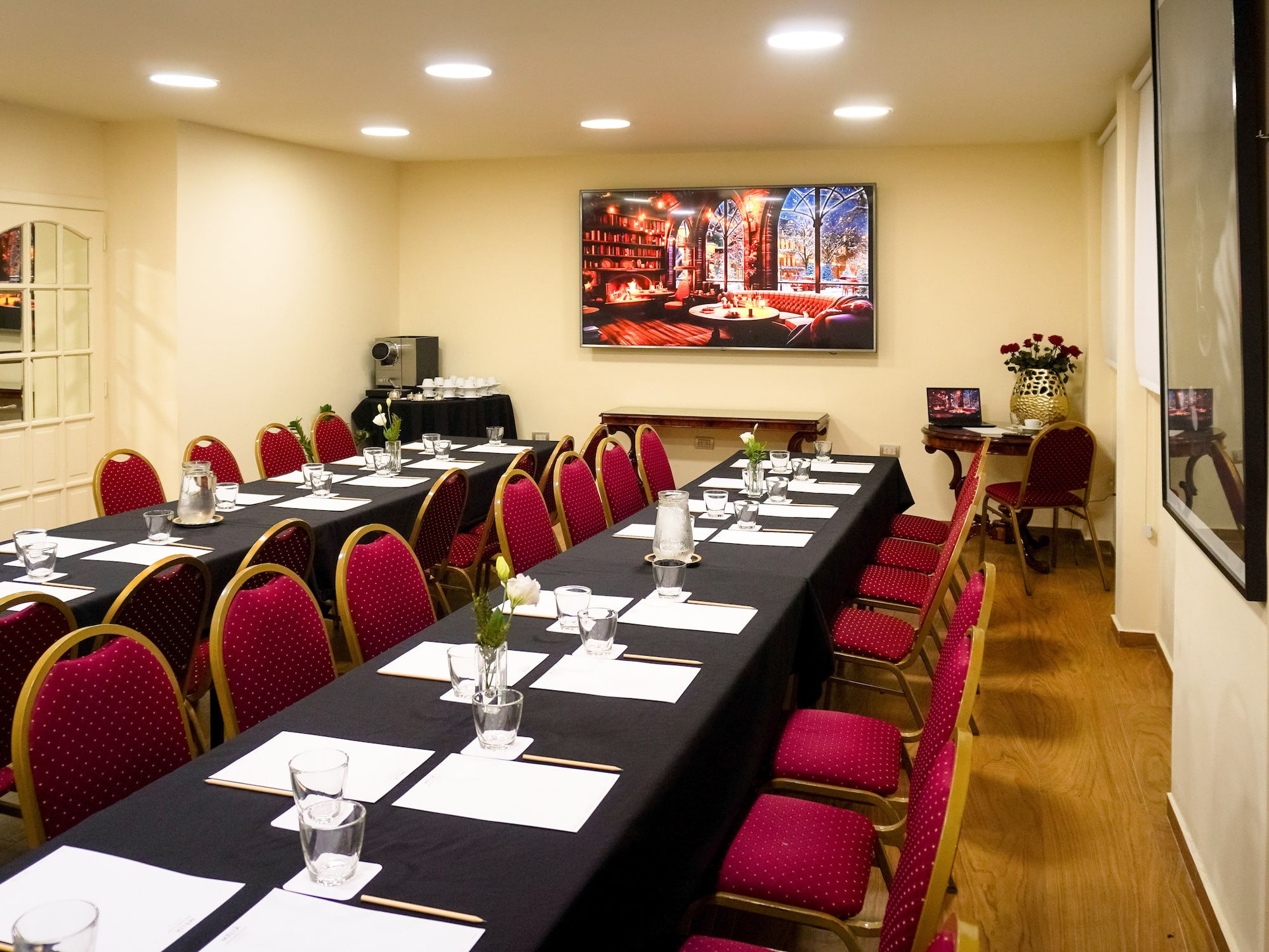 a room with a long table and chairs