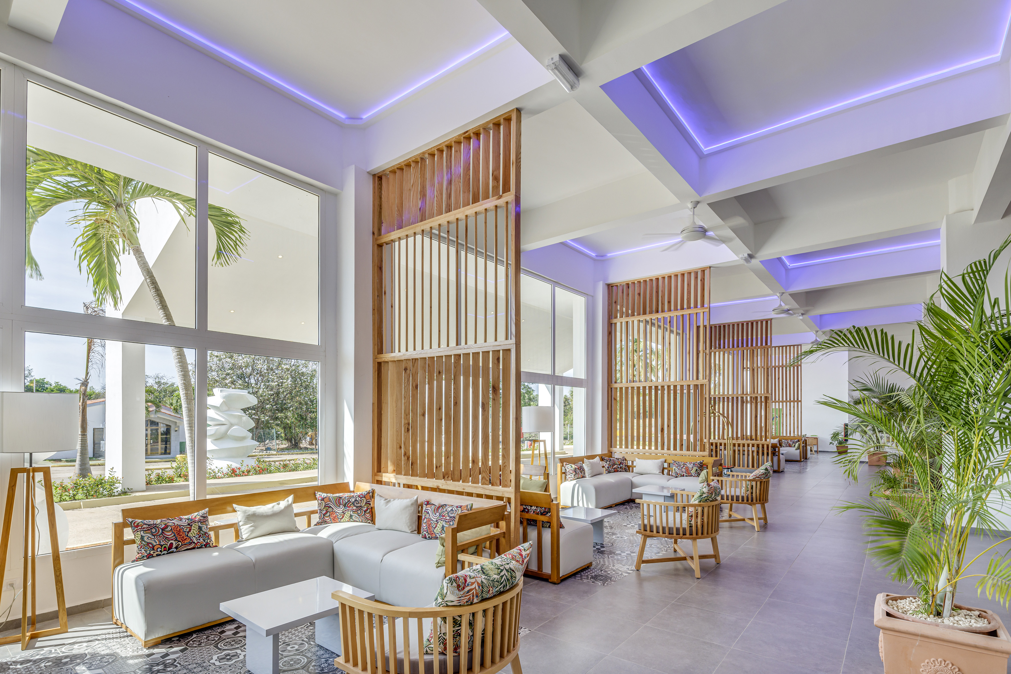 a room with a large window and a couch