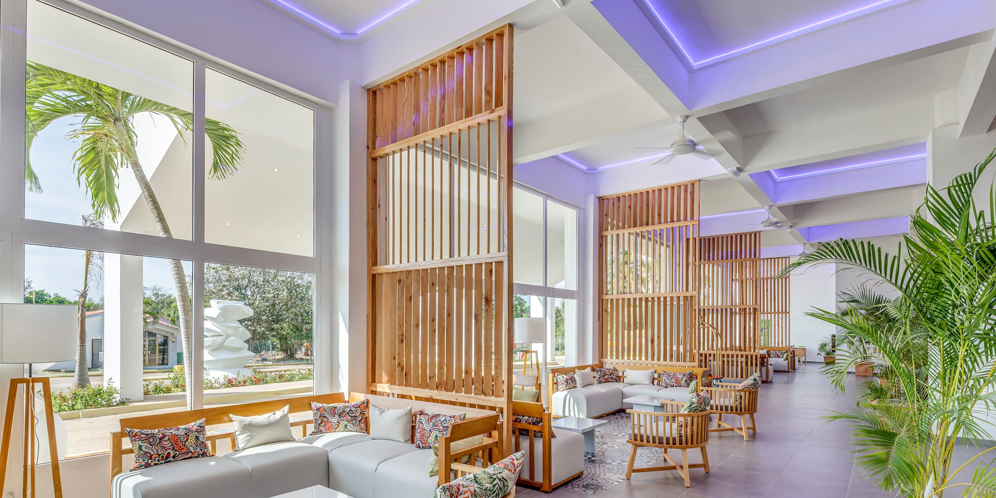 a room with a large window and a couch